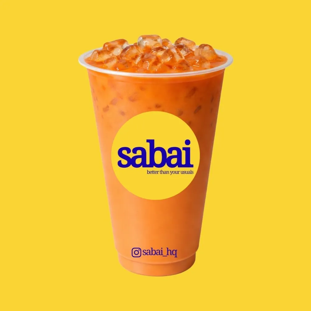 Sabai Thai Red Milk Tea — sunshine yellow background, classic orange milk tea with chunky ice